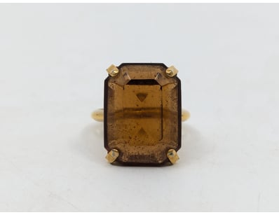 ring with brown glass stone

