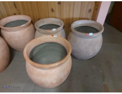 Collection of Four hand-thrown terracotta storage ...