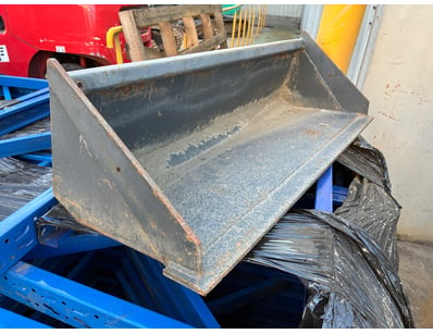 Heavy-duty steel bucket attachment featuring a rob...