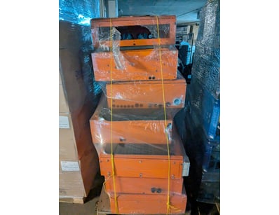 Stacked orange and black industrial electrical dis...