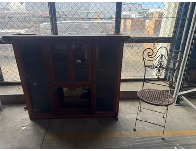 Vintage timber display cabinet featuring a dark st...