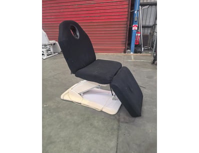 Electric massage chair with cream/beige plastic ba...