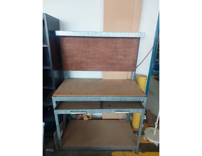 Multi-layered metal and timber workbench toolbox.