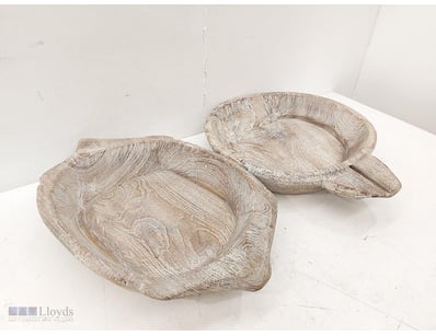 Pair of hand-carved wooden bowls with organic, she...