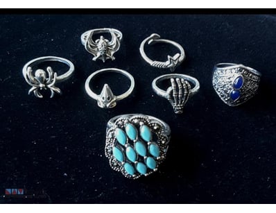 7 ASSORTED SILVER TONE RINGS        

Condition: G...