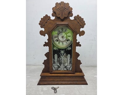 Victorian-era ornamental mantel clock featuring el...