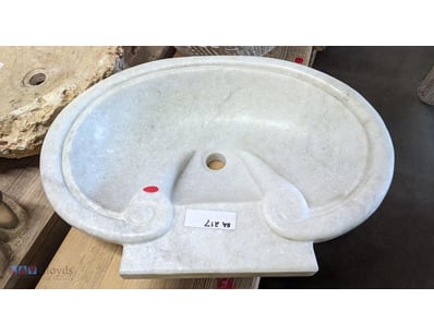 Marble vanity basin featuring a classical oval des...