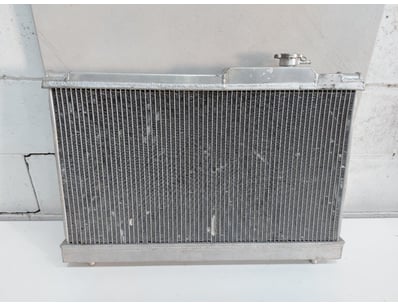 Aluminum automotive radiator featuring a compact d...