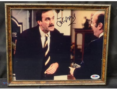 THIS FRAMED MEMORABILIA FEATURES A PHOTOGRAPH OF A...