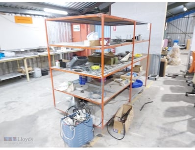Industrial orange steel shelving unit featuring a ...
