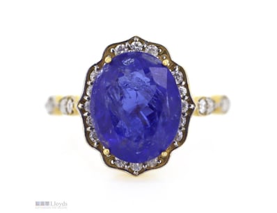 14K ROSE GOLD, DIAMOND AND TANZANITE, HALO RING.  ...