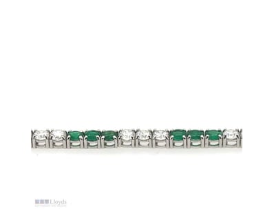 18CT WHITE GOLD EMERALD AND DIAMOND TENNIS BRACELE...