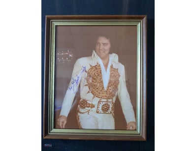 SIGNED PHOTOGRAPH OF ELVIS PRESLEY IN ICONIC WHITE...