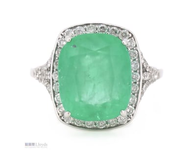 THE CENTRE FEATURES, ONE CUSHION CUT, BLUISH-GREEN...