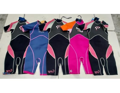 Lot of five children's wetsuits in various styles....