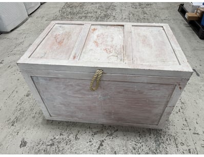 Whitewashed wooden storage trunk with distressed f...