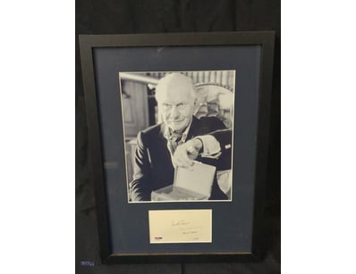 THIS FRAMED COLLECTIBLE FEATURES A BLACK AND WHITE...