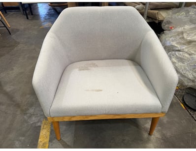 Mid-century modern accent chair featuring a curved...