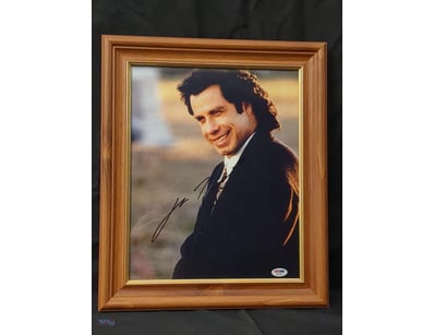 A SIGNED PHOTOGRAPH OF ACTOR JOHN TRAVOLTA IN CHAR...