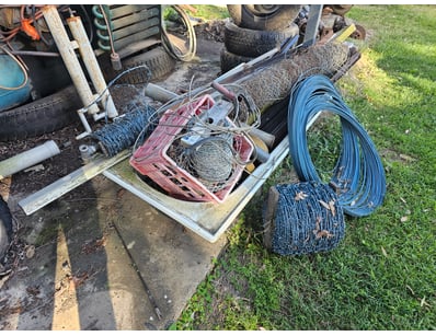 Assorted fencing materials, including barbwire, wi...