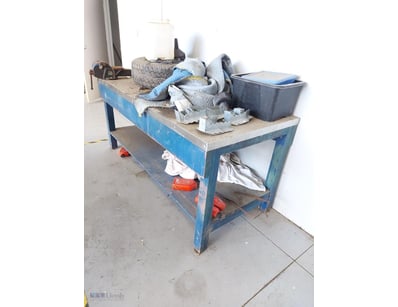 Heavy-duty industrial workbench featuring a robust...