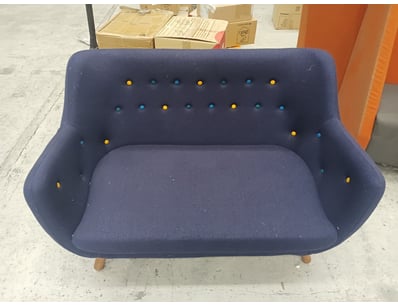Modern two-seater sofa upholstered in navy blue fa...