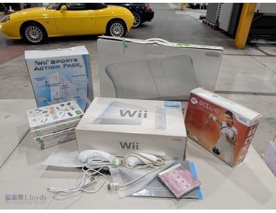 Nintendo Wii console bundle featuring a white PAL ...