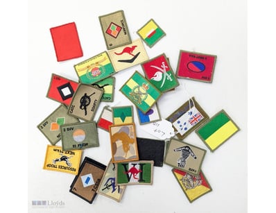 COLLECTION OF MILITARY UNIT PATCHES AND INSIGNIA B...