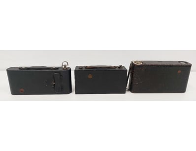 COLLECTION OF THREE VINTAGE FOLDING CAMERAS IN ORI...