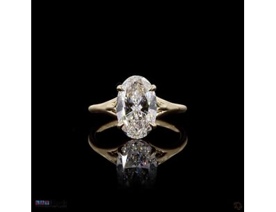 3.11 CT OVAL SPLIT-SHANK SOLITAIRE RING IN 18KT YE...