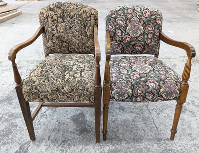 Pair of traditional wooden armchairs featuring orn...
