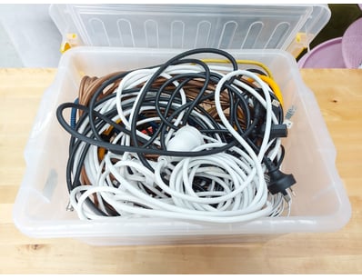Assortment of electrical cords and cables in clear...