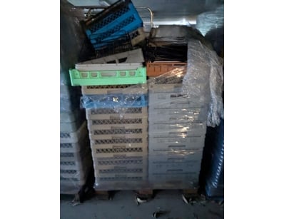 Large collection of plastic storage crates and bas...