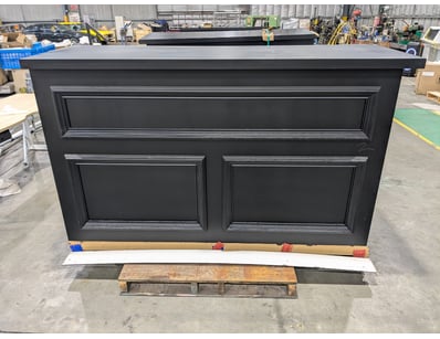 2x Professional-grade black bar counter unit featu...