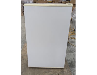 White upright freezer in compact design, featuring...