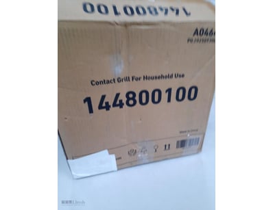 Contact grill for household use in box.

