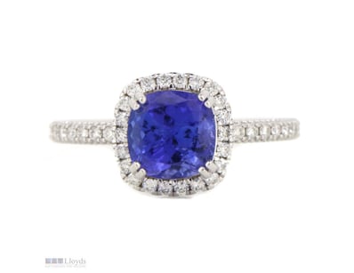 14K WHITE GOLD, TANZANITE AND DIAMOND, HALO RING. ...
