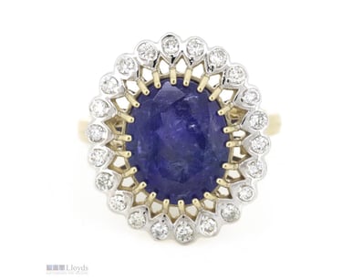 14K YELLOW GOLD, TANZANITE AND DIAMOND, HALO RING....