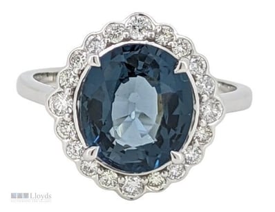 9CT WHITE GOLD BLUE TOPAZ AND DIAMONDS RING

Prove...