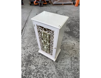 Elegant white timber cabinet featuring ornate deco...