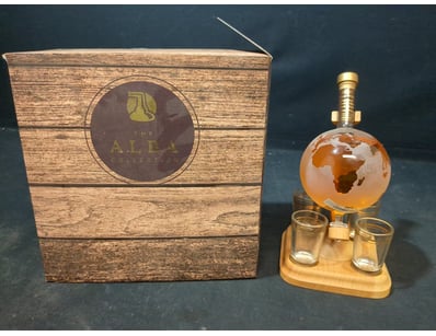 The Alba Collection globe decanter set featuring a...