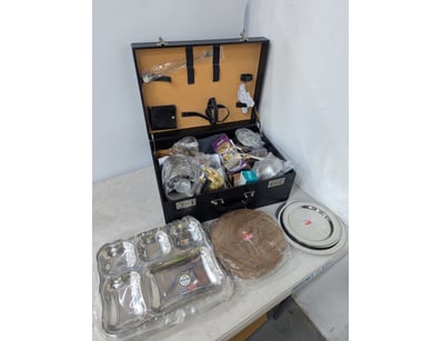 Assorted ornaments in lockable case, stainless ste...