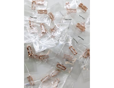 COLLECTION OF 'XOXO' ROSE GOLD COLOURED CHARMS

To...