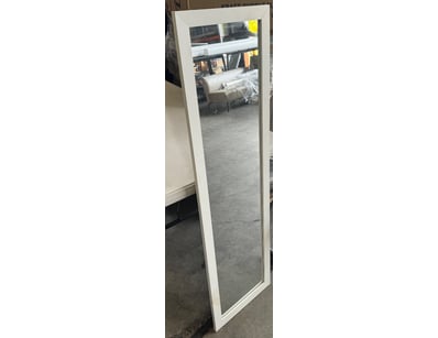 Tall narrow mirror with white timber frame featuri...