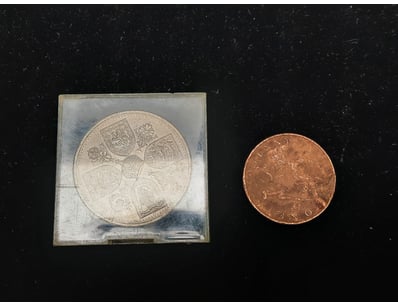 ONE UK CROWN COIN AND 1897 UK ONE PENNY.

997480...