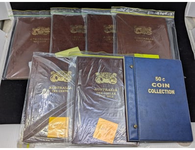 SEVEN EMPTY COIN ALBUMS

583007+32


