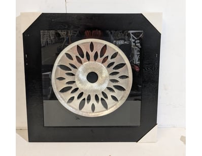 Contemporary wall-mounted display box featuring a ...