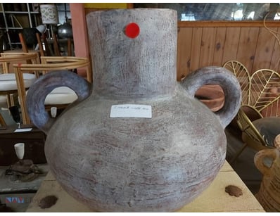 Rustic Terracotta vessel featuring distinctive two...