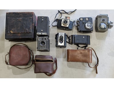 VINTAGE CAMERA COLLECTION WITH LEATHER CASES

In...