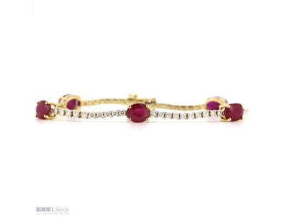 14K YELLOW GOLD, RUBY AND DIAMOND, LINE BRACELET. ...